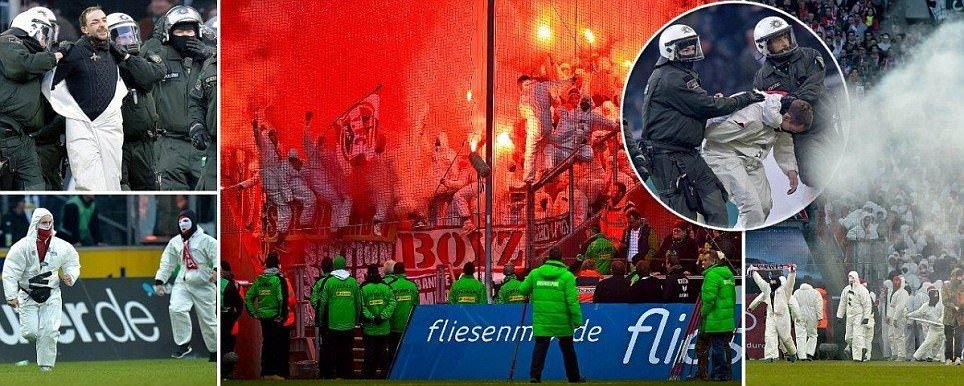 FOTO Incidente grave in Germania! 30 de anarhisti MASCATI au patruns pe gazon si au oprit meciul: 